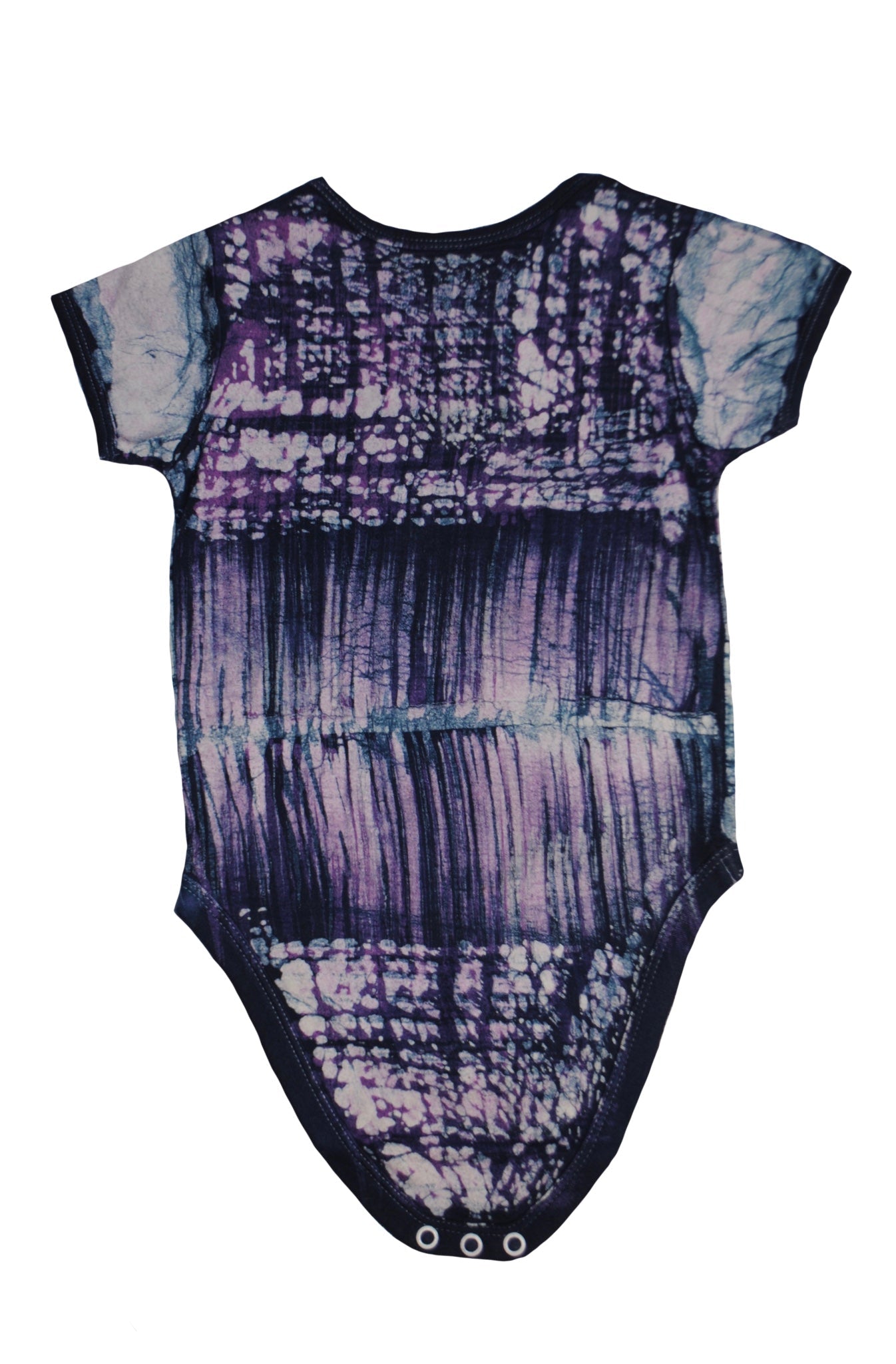 Close-up of blue bear onesie showing batik patterns and snap closures