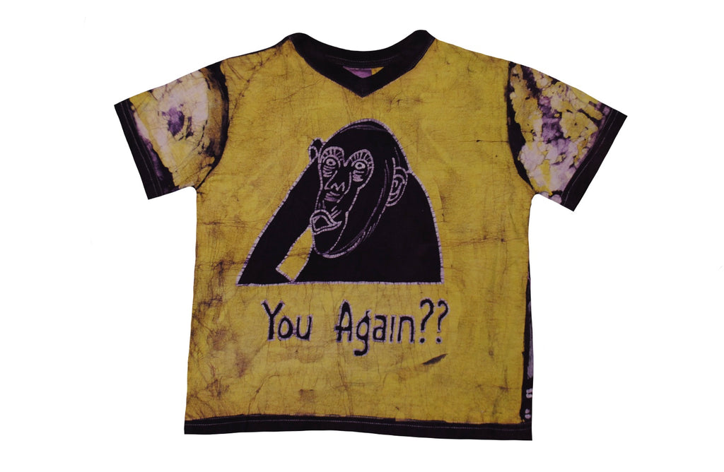 SmileGiver Batik kids yellow gorilla “YOU AGAIN??” African batik t-shirt, front view, on white background.