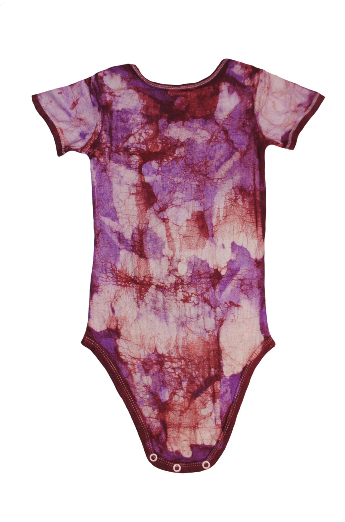 Close-up of red pink monkey onesie showing batik patterns