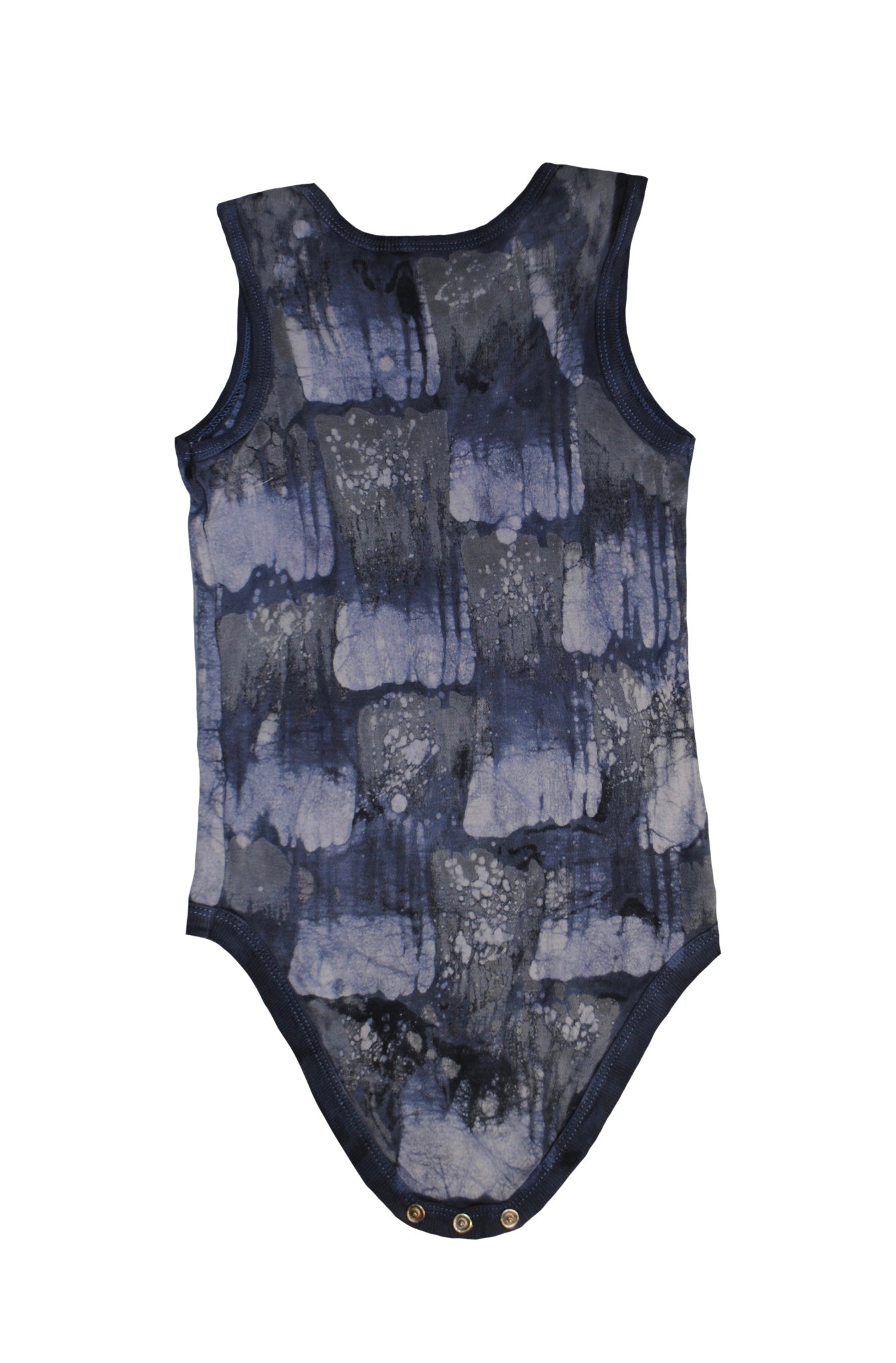 Close-up of grey dino onesie showing batik patterns