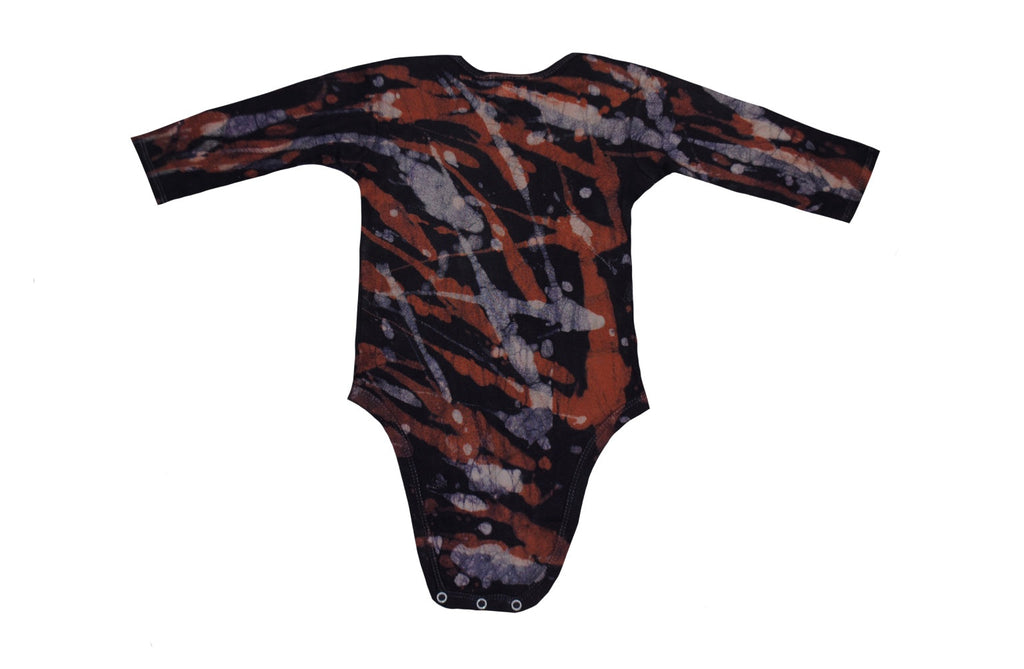 Close-up of orange grey camo onesie showing batik patterns