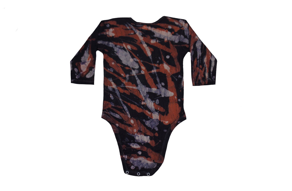 Folded back view of orange grey camo batik onesie