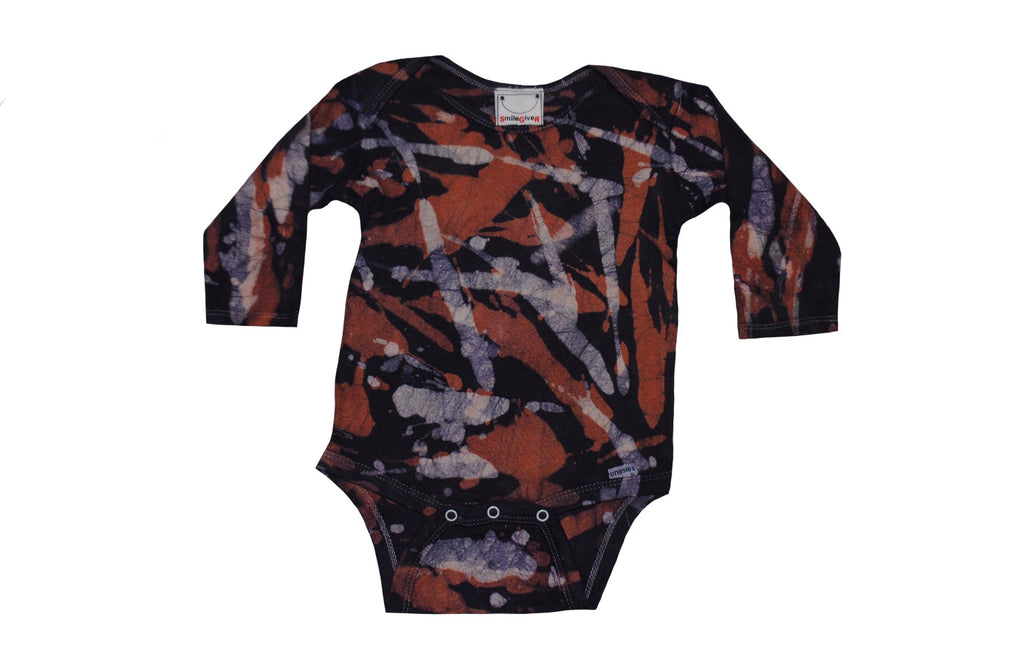 Folded back detail of orange grey camo batik onesie