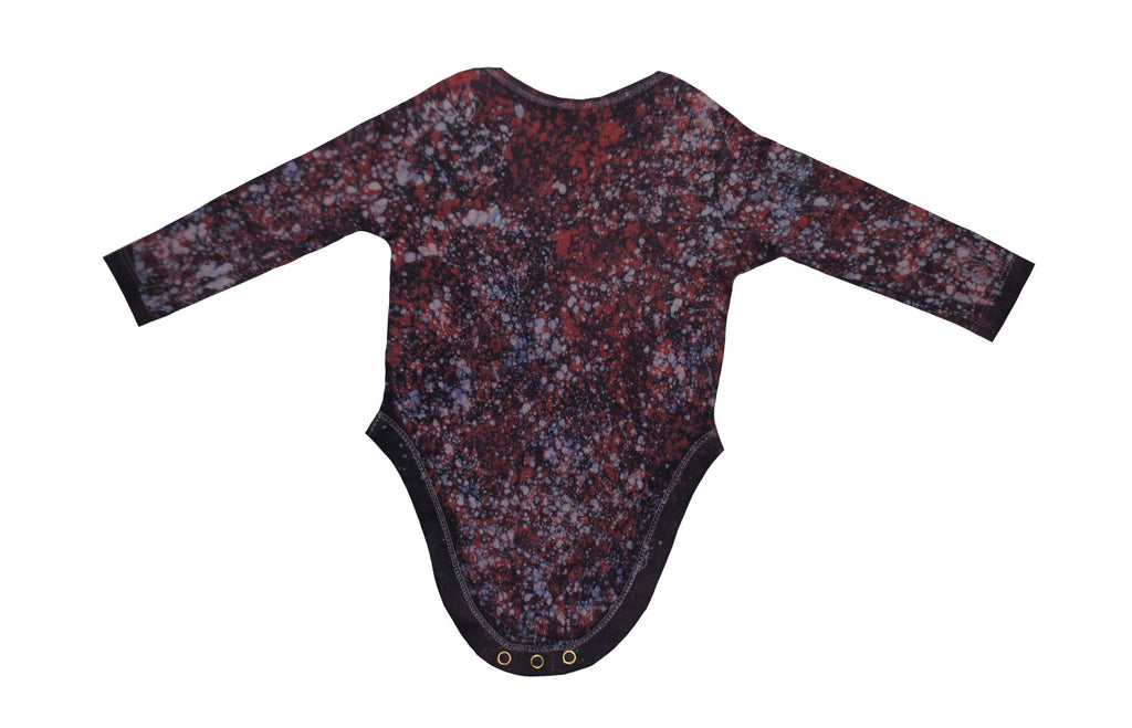 Close-up of red blue monkey onesie showing batik details