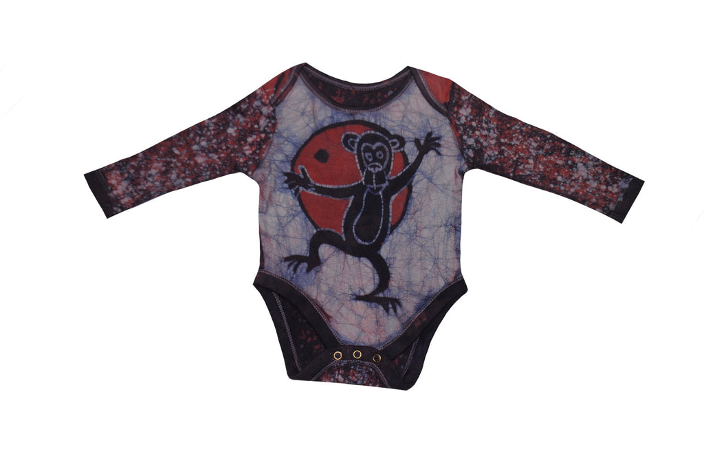 Back view of red blue monkey batik onesie with African patterns